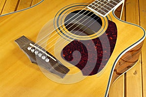 Acoustic guitar top with six strings closeup