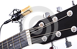 Acoustic Guitar Tuners with Gold Condenser Microphone in Background