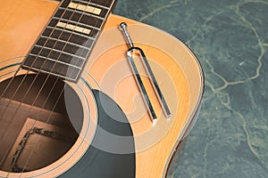 Acoustic guitar and tuning fork