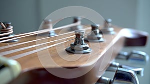 Acoustic guitar tuning pegs with strings