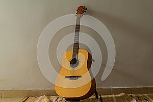 acoustic guitar on a wall