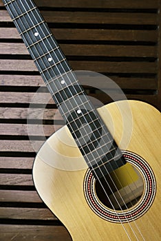 Acoustic guitar on a wooden floor