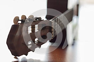 Acoustic Guitar on wooden table with copy space