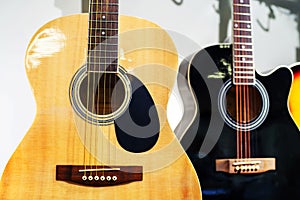 Acoustic guitars on the counter in a musical instrument store. Close-up