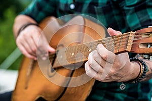 Acoustic guitars playing. Music concept. Guitars acoustic. Live music. Music festival. Male musician playing guitar