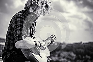 Acoustic guitars playing. Music concept. Guitars acoustic. Male musician playing guitar, music instrument. Black and