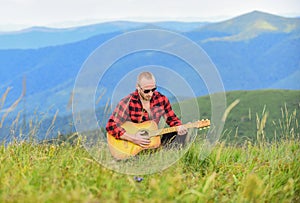 Acoustic music. Music for soul. Playing music. Sound of freedom. In unison with nature. Musician hiker find inspiration