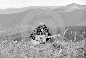 Acoustic music. Music for soul. Playing music. Sound of freedom. In unison with nature. Musician hiker find inspiration