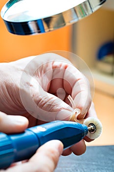 Acoustician working on a hearing aid