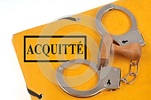 Acquittal file with handcuffs and an ink pad