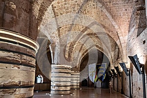 Huge stone dining hall with massive stone columns at the Templar fortress in the Acre old city in northern Israel