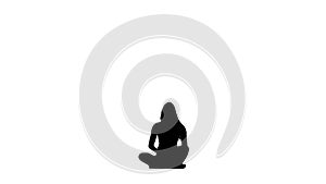 Acrobat girl sits on the twine, then sits down in the lotus pose. White background. Silhouette. Slow motion