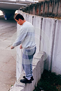 Acrobat man training parkour exercise while jumping backflip obstacles