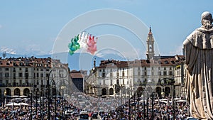 Acrobatic air performance of Frecce tricolori tricolour arrows in the sky over piazza Vittorio, Turin, Italy