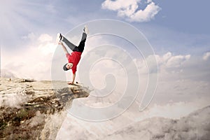 Acrobatic competition cartwheel on mountain photo