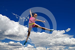 Acrobatic girl in midair