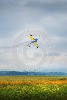 Acrobatic plane flying low