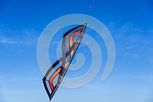 Acrobatic Stunt kite flying in the blue sky