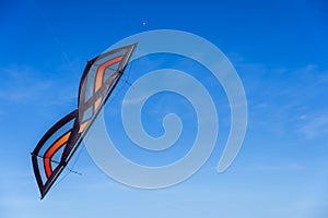 Acrobatic Stunt kite flying in the blue sky