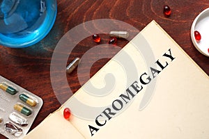 Acromegaly written on book with tablets.