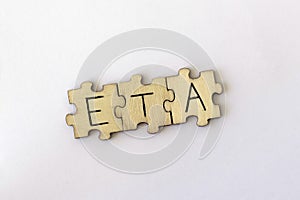 The acronym ETA, which stands for Estimated Time of Arrival. The letters written on the puzzles.