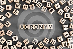 acronym - word from wooden blocks with letters photo