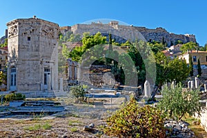 Acropolis hill over the winds tower in the Roman forum, Athens Greece