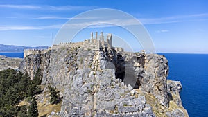 The Acropolis of Lindos in Rhodes island Greece. Saint Paul's Beach and Lindos Acropolis aerial panoramic view