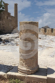 Acropolis of Lindos, the ruins of an ancient temple and the remains of the Doric columns. Lindos, Rhodes, Greece