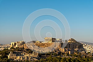 The Acropolis and Parthenon under a blue sky viewed from Phillipappas Hill