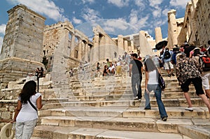 Acropolis and people walking in the ancient city in Athens, Greece.