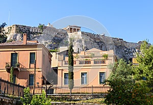 Acropolis rises over houses in Plaka district, Athens, Greece, Europe