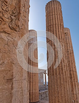 Acropolis, view between columns to the small Ionian style Athena Nike (victorious) ancient temple.