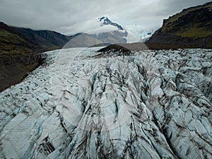 Across glacier crevices, surface of ice caps, natural attraction, aerial shot