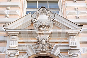 Acroteria on the facade of white architectural building