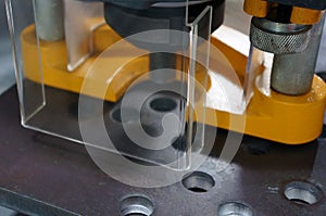 An acrylic cover safety guard in the metal machine in industry plant.