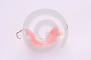 Acrylic denture with metal clasps for restoring dentition