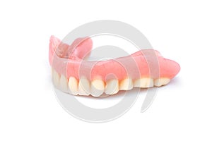 Acrylic dentures isolated on white background. Removable dentures flexible. False teeth