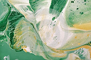 Acrylic Fluid Art. Natural green and yellow colors flow on canvas. Digital decor. Abstract stone background or texture