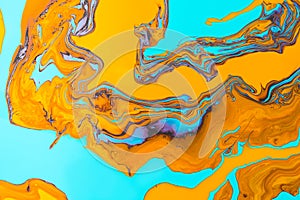 Acrylic Fluid Art. Orange flame curls and waves on turquoise background. Abstract marble background or texture