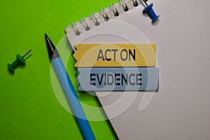 Act On Evidence write on sticky note isolated on Office Desk