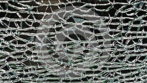 The act of malicious hooliganism. Broken glass wall. photo