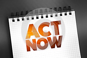 Act Now text quote on notepad, concept background