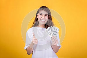 Action beautiful young girl on yellow background