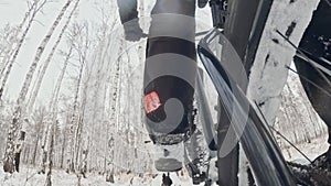 Action cam on frame installed behind. Close-up pov view. Professional extreme sportsman biker riding fat bike in outdoor