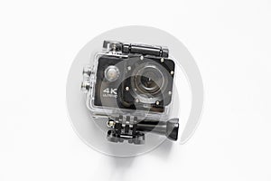 Action camera in a protective plastic box on a white background close up