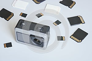 Action camera and SD and MicroSD memory cards. Background from gadgets and digital devices