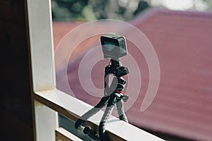 Action camera on tripod capturing time-lapsed video