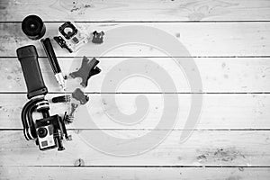 Action camera on the wooden table with a stabilizer