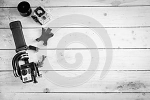 Action camera on the wooden table with a stabilizer